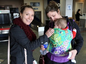 Jen Stanley, left, of Corunna, Ont., drops off her friend Whitney Goulet and her daughter Grace at Windsor International Airport Feb. 3, 2016.