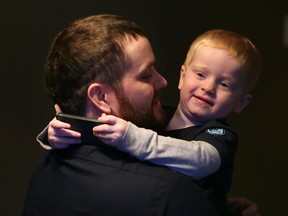 Myles Heinrichs, 2, greets his father Tim Heinrichs, who had just come through the door on Feb. 4, 2016.