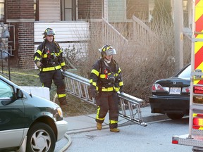 Windsor firefighters work the scene of 820 Dougall Avenue in Windsor, Ontario on February 5, 2016. Windsor Fire Service listed the cause as failure of wiring in the attic, 6 displaced, no injuries, damage $250,000 (JASON KRYK/WINDSOR STAR)