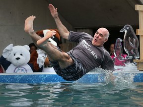 Windsor police Chief Al Frederick jumps into an ice-cold swimming pool during the 2016 Polar Plunge event at St. Clair College in Windsor, Ont. on Feb. 3, 2016.  The Second annual Polar Plunge event in partnership with area police services and St. Clair College raises funds for for Special Olympics.