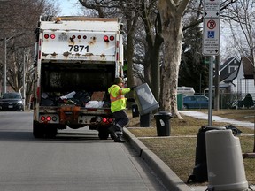 Driver loader with GFL picks up garbage on the 1200 block of Partington Avenue Monday Feb. 22, 2016.