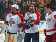Roberto Luongo #1 of the Florida Panthers, Aaron Ekblad #5 of the Florida Panthers, and Dylan Larkin #71 of the Detroit Red Wings look on during the 2016 Honda NHL All-Star Skill Competition at Bridgestone Arena on January 30, 2016 in Nashville, Tennessee.