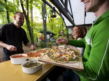 Guests making artisan pizza in the forest. - Courtesy Northern Edge Algonquin