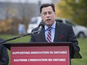 Brad Duguid, Minister of Economic Development, Employment and Infrastructure, speaks during a press conference at the University of Waterloo in this 2015 file photo.