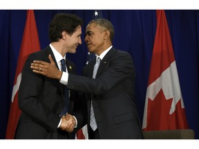 U.S. President Barack Obama, right, and Canada's Prime Minister Justin Trudeau shake hands following their bilateral meeting at the Asia-Pacific Economic Cooperation summit in Manila, Philippines, Thursday, Nov. 19, 2015.