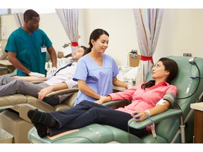 Blood donors making donation. Photo by fotolia.com.