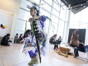 Chayton Hedgebeth, 15, performs a grass dance dresses as a First Nations member of the Oneida Nation, during a free admission day at the newly opened Chimczuk Museum, Saturday, February 20, 2016.