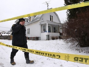 Mike Ross, an investigator with the Ontario Fire Marshal's office is shown Monday, Feb. 15, 2016, on the scene of a fatal house fire at 395 Curry Ave. in Windsor, Ont. The fire occurred Saturday evening.