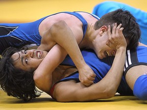 Jake Sullivan (top) of Turner Fenton gets Haris Ahmed of Brantford CI in a tight spot during OFSAA wrestling championships at the WFCU Centre in Windsor, Ont. in this 2015 file photo.