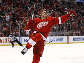 Red Wings rookie Dylan Larkin celebrates his goal against the New York Islanders in the third period of an NHL hockey game, Saturday, Feb. 6, 2016 in Detroit.