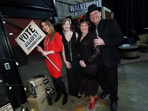 Sarah Meeke, left, Carly Erber, Adelina Trottier and Gerry Trottier attend the Charity Chix rum runner themed gala at the Walkerville Brewery on Thursday, Feb. 25, 2016.