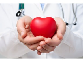 Doctor protecting a heart. Photo by fotolia.com.