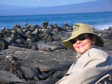 ago. - Courtesy Theresa Dugal

With sea lions in the backdrop, Theresa Dugal smiles for the camera during her trip to the Galapagos Island about eight years ago.- Courtesy Theresa Dugal