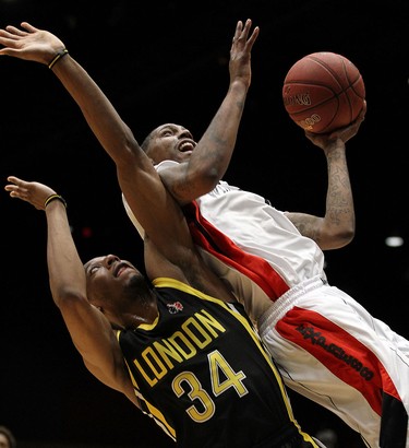 The Windsor Express' Brandon Robinson collides with the London Lightnings Marcus Capers during the Clash at the Colosseum at Caesars Windsor on Wednesday, February 3, 2016.