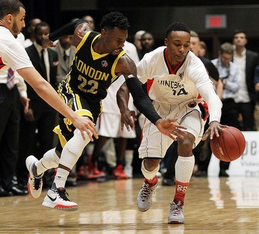 The Windsor Express' Alex Johnson fights for the loose ball with the London Lightnings Tyshawn Patterson during the Clash at the Colosseum at Caesars Windsor on Wednesday, February 3, 2016.