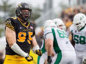 Defensive tackle Brian Bulcke is pictured during his time with the Hamilton Tiger Cats after he sacked Saskatchewan Roughriders quarterback Tino Sunseri in this 2014 file photo.