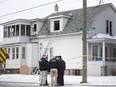 Windsor police work at the scene of a house fire at 395 Curry Ave., Saturday, February 13, 2016.