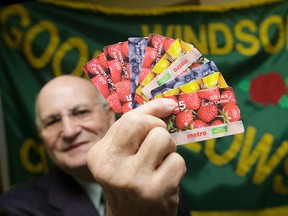 Windsor Goodfellows vice president Gilbert Barichello displays food gift cards that helped feed 5900 families during the Goodfellows Christmas Basket campaign. Final numbers were in this week and the Goodfellows are celebrating their efforts to feed families in the area.