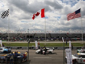 GT and GTS race cars prepare to race at the Chevrolet Detroit Belle Isle Grand Prix in this 2013 file photo.