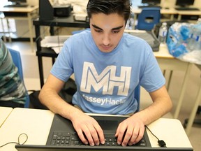 Sina Ghanadian, 15, participates in Masseyhacks, a 12-hour hackathon at Massey High School, Saturday, Feb. 27, 2016.