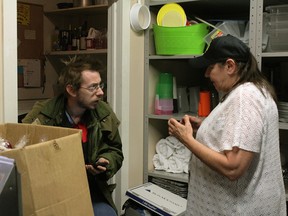 Christine Wilson-Furlonger, founder of Street Help Homeless Centre of Windsor, speaks to a volunteer about arranging new donations. - Ashley Ann Mentley photo