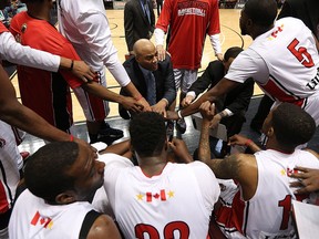 The Windsor Express coach Bill Jones chats with his team on the sideline as they take on the London Lightning at the WFCU Centre in Windsor on Thursday, March 3, 2016.