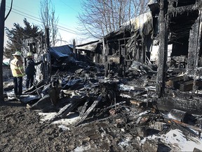 Lakeshore Fire investigators remained on the scene Thursday as they searched for clues in the cause of a house fire at 803 Valentino Drive in LakeShore, Ontario on Feb. 11, 2016.