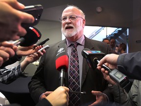 Leamington Mayor John Paterson speaks to reporters on Tuesday, Feb. 2, 2106, at Lakeside Produce in Leamington, Ont.