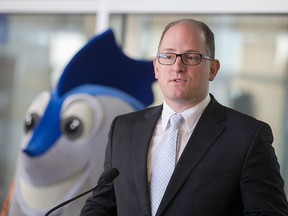 Windsor mayor Drew Dilkens is joined by FINA mascot Splasher in this January 2016 file photo.