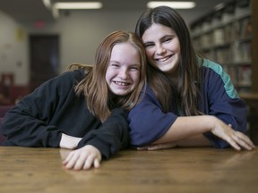 Twin sisters, Amber, left, and Ashley White, 14, pictured in the library at Leamington District Secondary School, are part of a mentoring program On Track to Success.