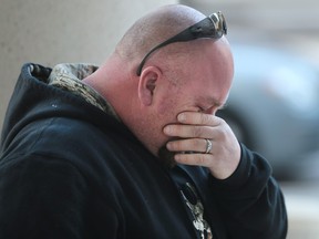 Fred Doughty breaks down outside the Ontario Court of Justice in Windsor on Feb. 1, 2016 after receiving upsetting personal news unrelated to the case he went to observe. Doughty was part of a group watching as Michael Earl Hill was sentenced to two years in jail for causing unnecessary suffering to a dog. The group presented the judge with a petition calling for Hill to receive the maximum sentence and a lifetime ban on pet ownership. Outside court, Doughty spoke about how angry he was with Hill.