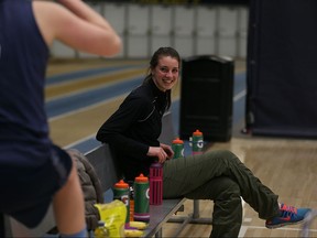 University of Windsor Lancers forward Andrea Kiss, seated, supports her teammates during Monday's practice after suffering an ACL injury and a medial meniscus tear in her right knee over a week ago.