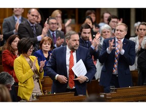 NDP Leader Tom Mulcair stands and is applauded during question period in the House of Commons on Parliament Hill in Ottawa on Wednesday, Feb. 17, 2016.