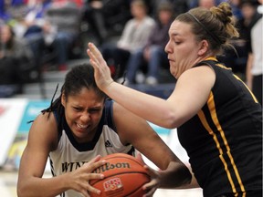 Cheyanne Roger, left, netted 26 points in the Windsor Lancers' victory over the Western Mustangs.