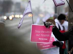 Area registered nurses hold an information rally along Tecumseh Road East in Windsor, Ont. on Feb. 15, 2016.