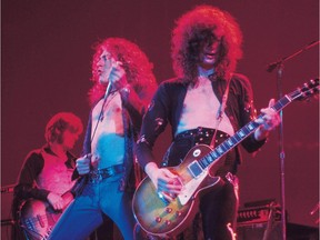 This undated photo shows Led Zeppelin's John Paul Jones, left, Robert Plant and Jimmy Page in concert.