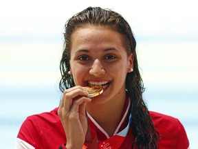 LaSalle swimmer Kylie Masse is pictured after winning Canada's second gold medal in the 100-metre backstroke at the Summer Universiade in Gwangju, South Korea in this July 2015 file photo.