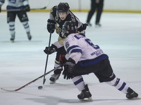 LaSalle's Daniel Beaudoin brings the puck up the ice against London's Alex Cimino in Junior B hockey action between the LaSalle Vipers and the London Nationals at the Vollmer Centre, Sunday, Feb. 28, 2016.