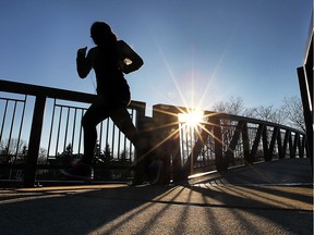 A runner crosses the Little River pedestrian bridge in this sunny January file photo.