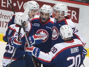 Windsor Spitfires, from left, Cole Carter, Tyler Nother, Cristiano DiGiancinto, Hayden McCool and Andrew Burns celebrate a goal during Saturday's win over the London Knights. After the game, the Spitfires' new 7th Man figure was stolen from the WFCU Centre,