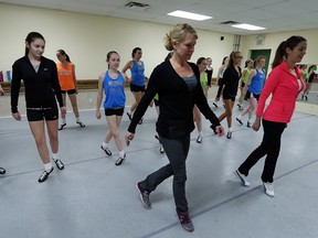 Windsor Star health and fitness reporter Kelly Steele, left, gets some Irish dance lessons from instructor Jourdy Bancroft at the Ardan Academy of Dance in Windsor on Tuesday, February 16, 2016.