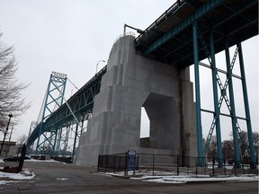 The Ambassador Bridge is seen in Windsor on Tuesday, Feb. 16, 2016. Observers and those targeted by the many lawsuits were surprised to see the Ambassador Bridge owners had sent an e-mail to the Toronto Star extending an "olive branch" to the Canadian government.
