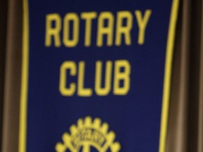 A Rotary Club banner.