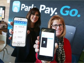 Kacey Siskind,  Director of Business Development for Honk Mobile, left, and Laurie Butler-Grondin - Manager of Parking Services at the University of Windsor,  display the new.