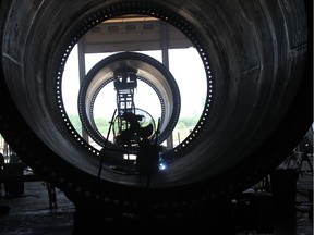 A CS Wind employee works on wind turbine at the company's plant in Windsor on June 4, 2015.