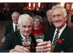 Windsor, Ontario - Nov 10, 2006- Bill Vivian  (age 80) Executive committee for the Air Force Club  of Windsor -Wing #412) and Bob Drago  (age 69) President of Royal Canadian Legion Branch #578)  toast to the memories as Branch #578 prepares to close it's doors at the Drouillard Location.    Legion Branch #578 will share space  at the Air Force Club of Windsor. (Jason Kryk/ Windsor Star)