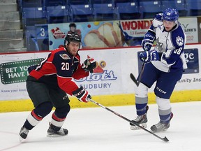 Dmitry Sokolov, right, of the Sudbury Wolves, attempts to skate past Andrew Burns, of the Windsor Spitfires, during OHL action at the Sudbury Community Arena in Sudbury, Ont. in this October 2015 file photo.