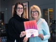 Heather Gregg, left, and Ronna Warsh are shown on Monday, Feb. 15, 2016, with a copy of Positioning Women for Success — Windsor-Essex, an assessment report they compiled.