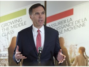 Minister of Finance William Morneau speaks with the media after delivering a speech to members of the business community in Ottawa, Wednesday March 23, 2016. THE CANADIAN PRESS/Adrian Wyld