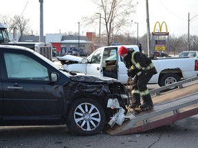 Crews work to clear the scene of an accident Monday, March 7, 2016, just after 8 a.m. at Ojibway Parkway and Weaver Road. Commuter traffic into Windsor was snarled for about an hour. No injuries were reported. (JULIE KOTSIS/Windsor Star)